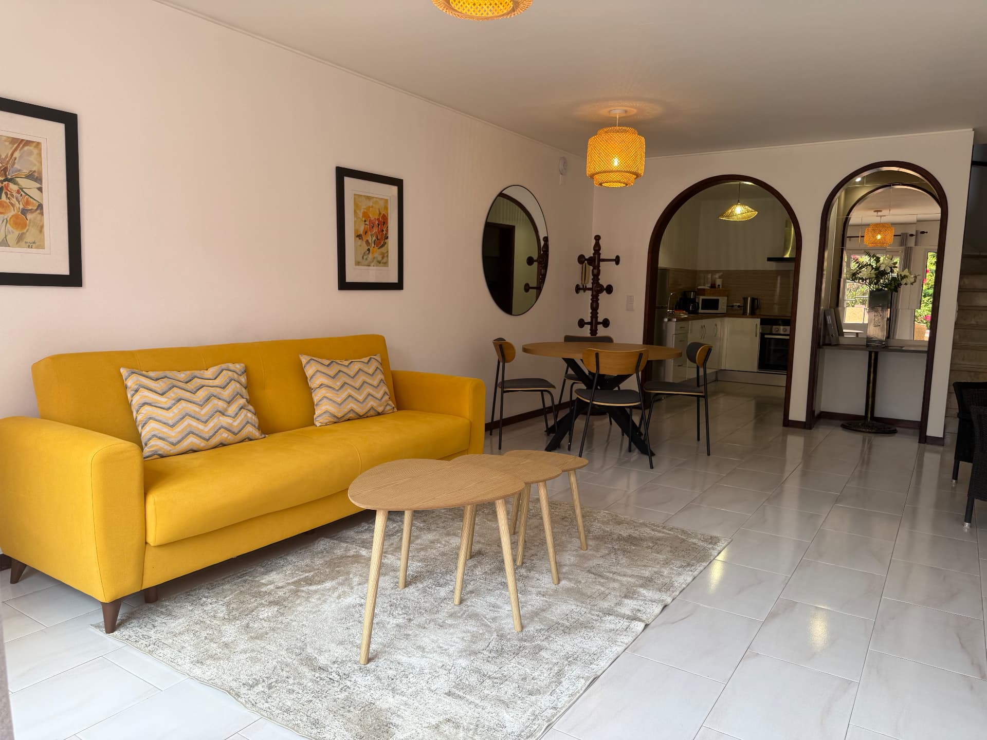 Wide view of the Comfort Villa living and dining area looking toward the kitchen archway